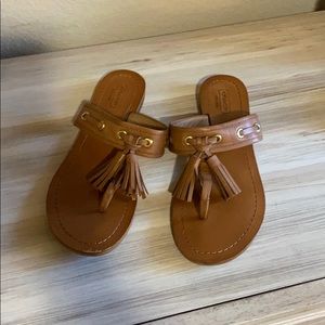 Brown slip on sandals by coach